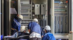 workers-plc-cabinet-maintenance