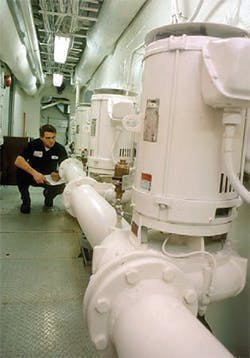 Figure 1. A horizontal pump motor in a vertical position. Note the motor feet and the drip cover. Figure 1. A horizontal pump motor in a vertical position. Note the motor feet and the drip cover.
