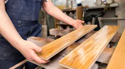Worker suffers partial arm amputation, hardwood flooring manufacturer fined $256K
