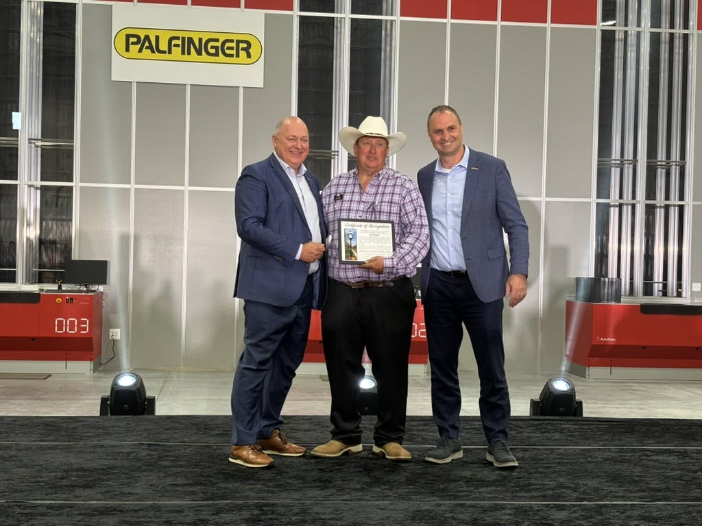 Palfinger executives with mayor of Huntley