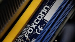 Closeup of the Foxconn logo printed on a computer motherboard. Closeup of the Foxconn logo printed on a computer motherboard.