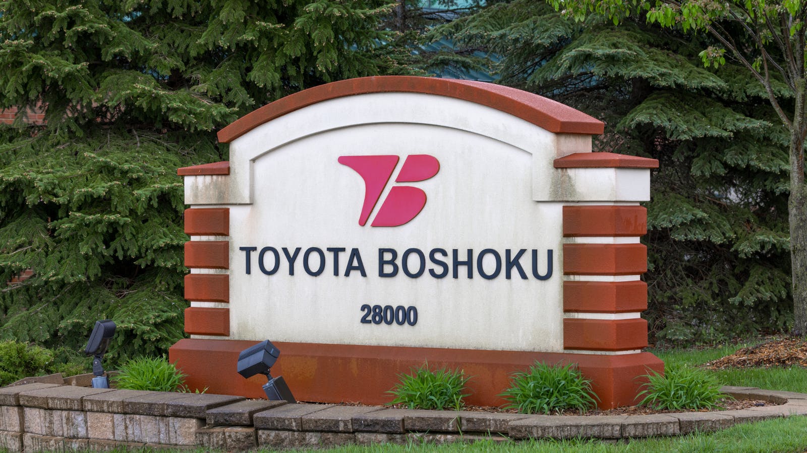 An photograph of a Toyota Boshoku sign outside one of its company locations.