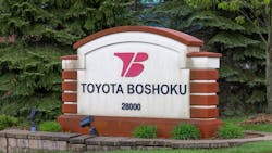 An photograph of a Toyota Boshoku sign outside one of its company locations. An photograph of a Toyota Boshoku sign outside one of its company locations.