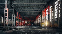 Interior of a large, abandoned warehouse or factory. Interior of a large, abandoned warehouse or factory.