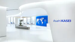 A clean, minimalist, white-walled office building lobby
