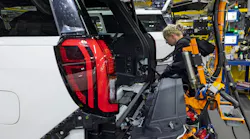 An employee at a Ford plant in Kentucky works on an Expedition SUV. Image credit: Ford
