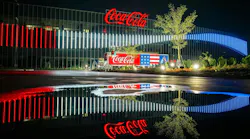 The new Coca-Cola Bottling Company United campus in Birmingham, Ala. is illuminated for America’s 250th birthday in July. Image credit: Coca-Cola Bottling Company United