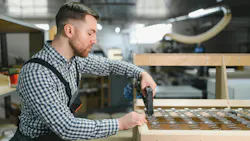 Carpenter assembling a sofa frame